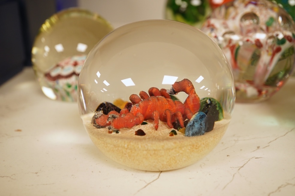 Seventeen various paperweights, including Lalique and a signed Murano example, some boxed, largest 10cm high